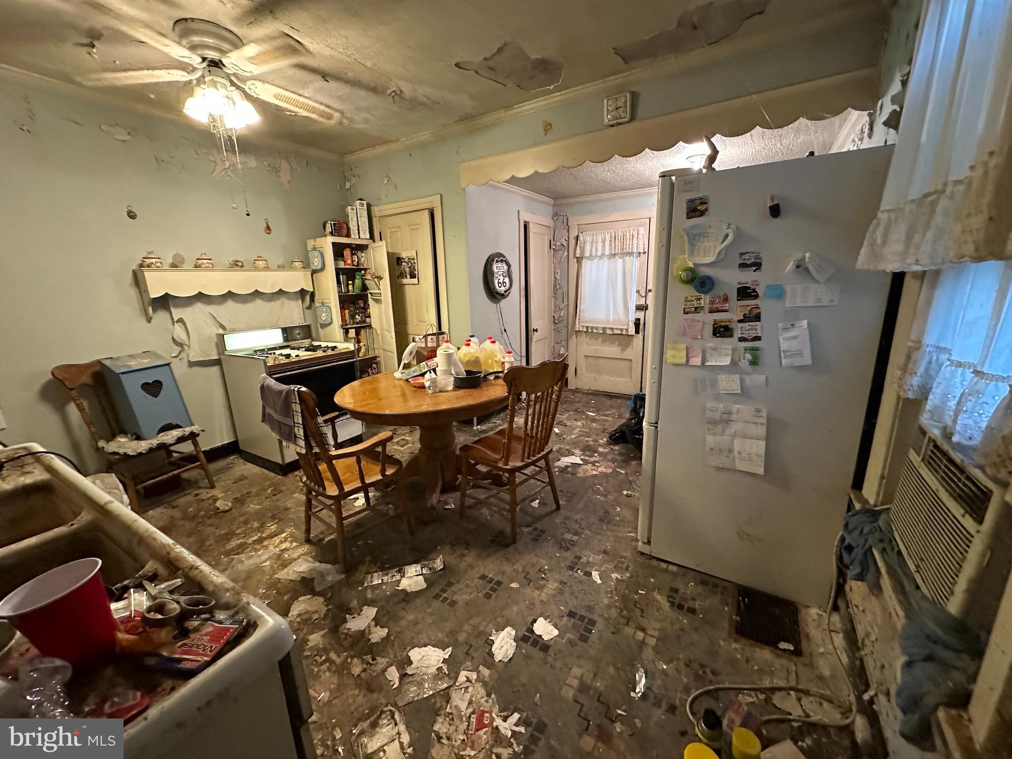 100 South 6th Avenue Reading, PA 19611 - Photo 5 of 19 a dining room filled with furniture and a chandelier