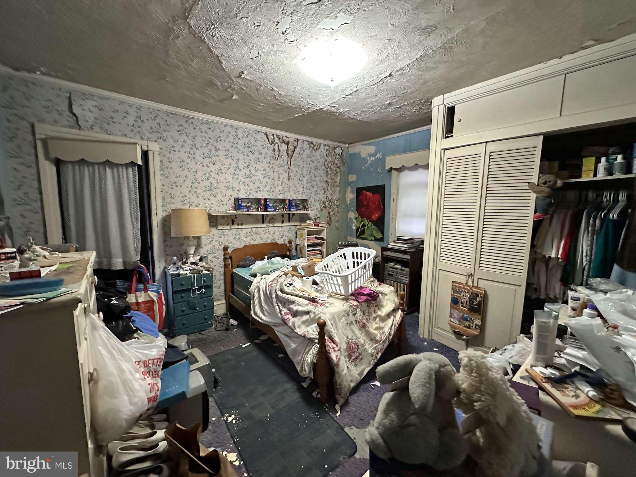 100 South 6th Avenue Reading, PA 19611 - Photo 9 of 19 a bedroom with furniture and a flat screen tv