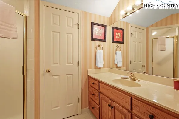 a bathroom with a sink a vanity and a mirror