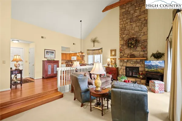 a dining room with furniture and wooden floor