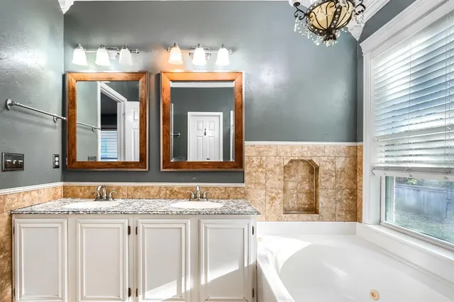 a view of a backyard with large trees