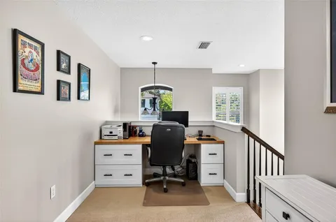 a bedroom with a bed and a cabinets