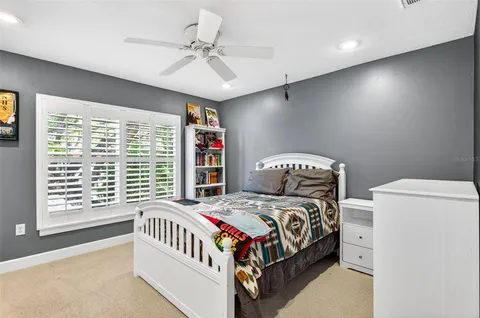 a room with large bed and furniture
