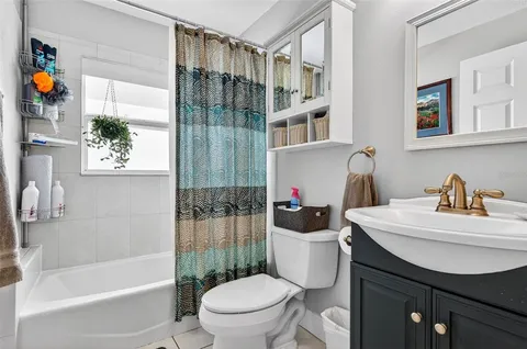 a view of walk in closet with clothes