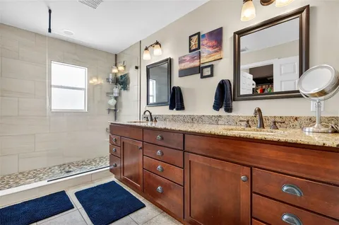 a open kitchen with stainless steel appliances a stove a sink and a microwave