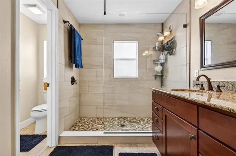 a view of swimming pool with outdoor seating and plants