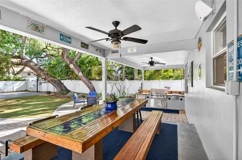 a view of house with backyard and a garden