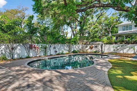 an aerial view of residential houses with city view