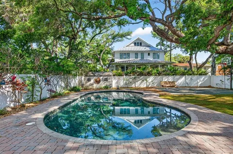 an aerial view of a houses with a lake view