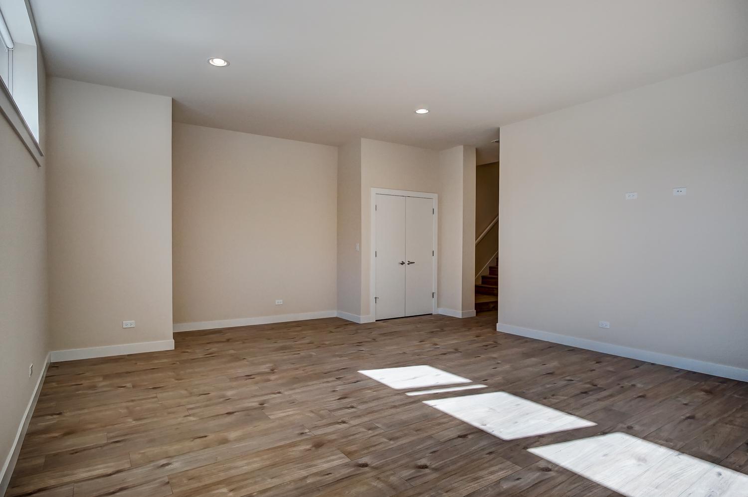 2532 West Addison Street, Unit 1W Chicago, IL 60618 - Photo 16 of 24 a view of room with wooden floor
