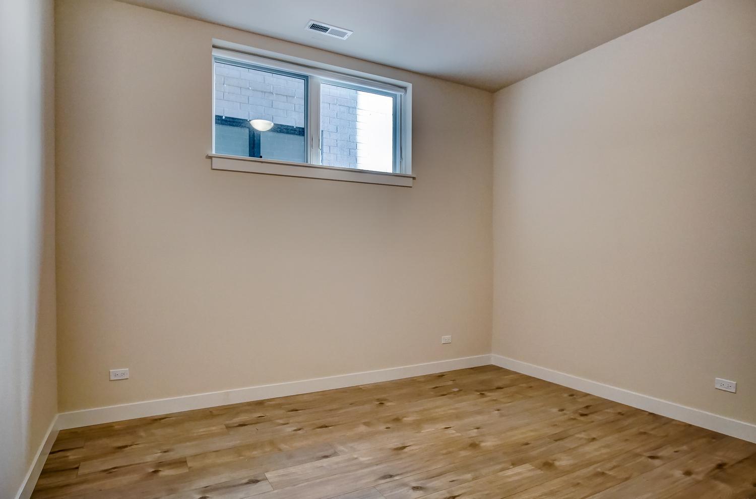 2532 West Addison Street, Unit 1W Chicago, IL 60618 - Photo 17 of 24 an empty room with a window