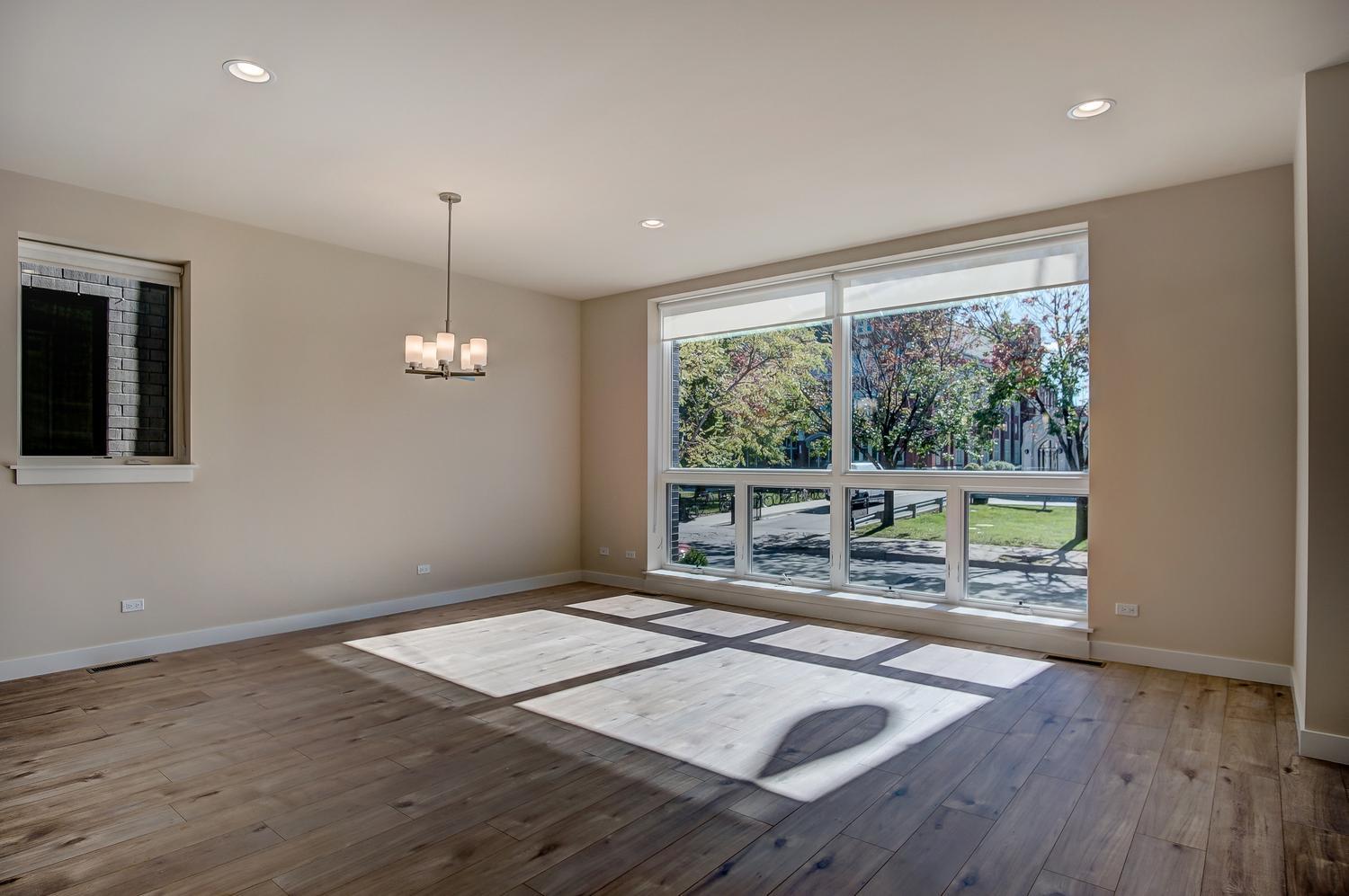 2532 West Addison Street, Unit 1W Chicago, IL 60618 - Photo 3 of 24 a very nice looking room with a large window