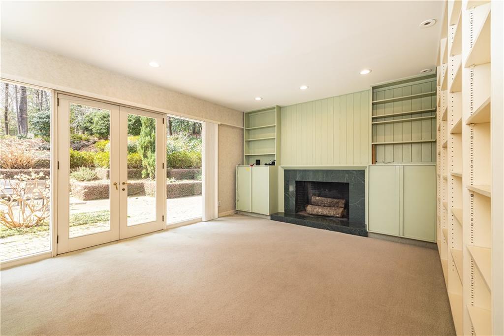 3248 Nancy Creek Road Northwest Atlanta, GA 30327 - Photo 16 of 44 a view of a livingroom with a fireplace and large windows