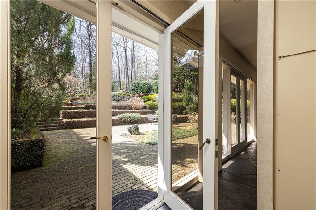 3248 Nancy Creek Road Northwest Atlanta, GA 30327 - Photo 22 of 44 a porch with a glass door