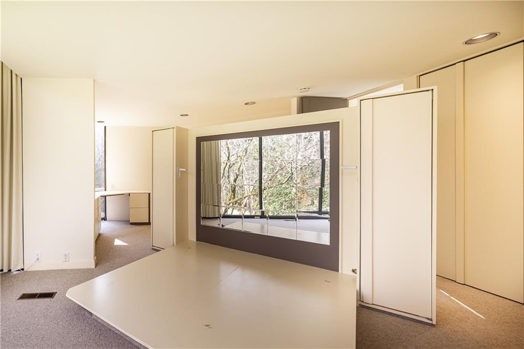 3248 Nancy Creek Road Northwest Atlanta, GA 30327 - Photo 25 of 44 a view of a big room with windows and chandelier