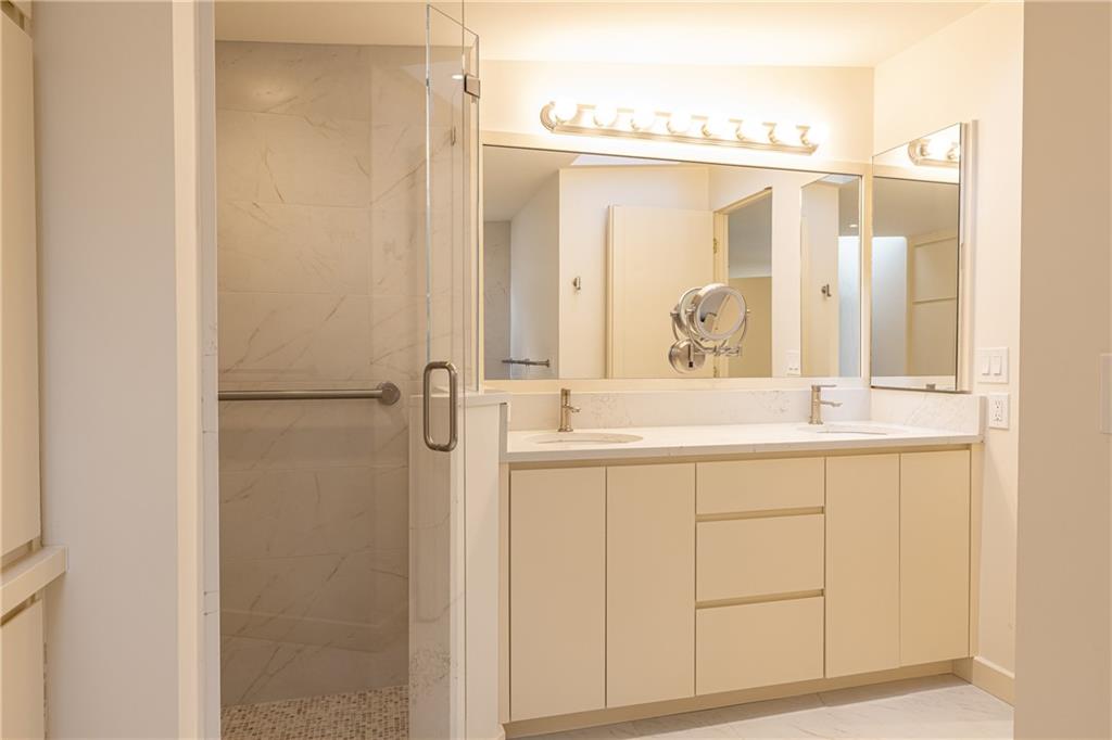 3248 Nancy Creek Road Northwest Atlanta, GA 30327 - Photo 27 of 44 a bathroom with a double vanity sink mirror and