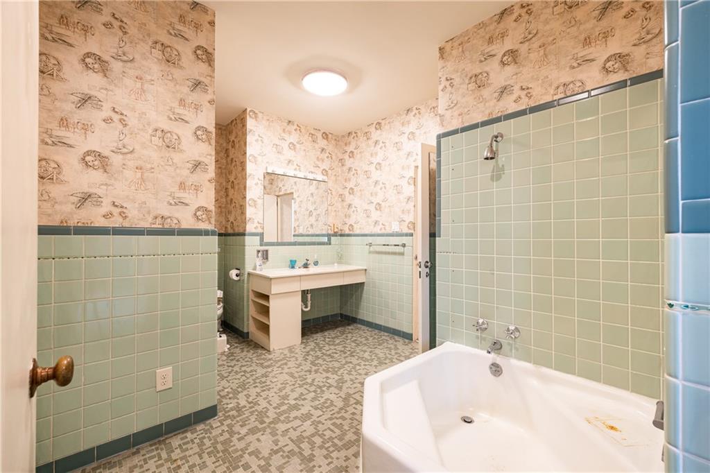 3248 Nancy Creek Road Northwest Atlanta, GA 30327 - Photo 35 of 44 a bathroom with a bathtub and sink