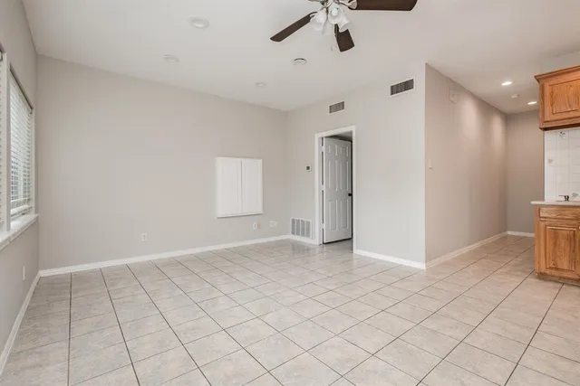a view of an empty room and a window