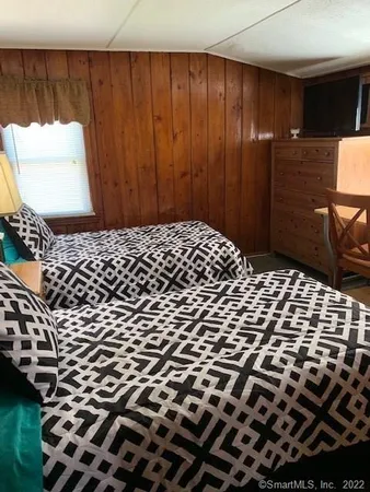 a bathroom with a shower and toilet