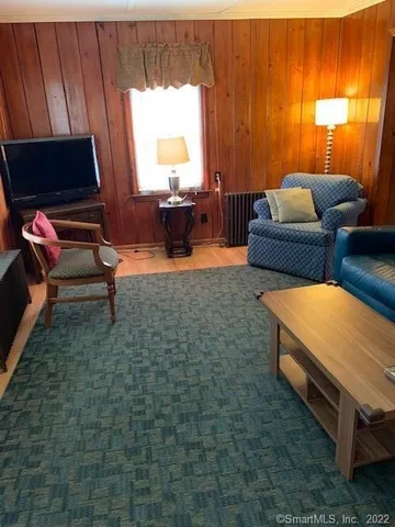 a bedroom with a bed and a table