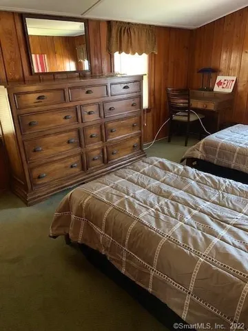 a bedroom with double bed and a window