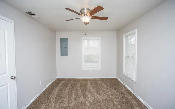 a view of an empty room and window
