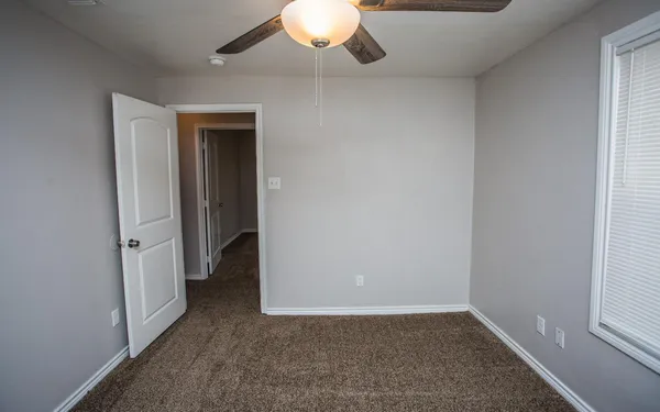 an empty room with a bathroom