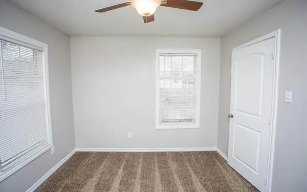 an empty room with windows