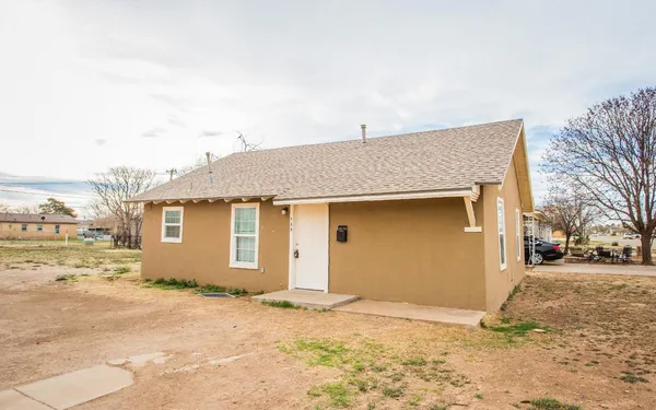 a view of garage and yard