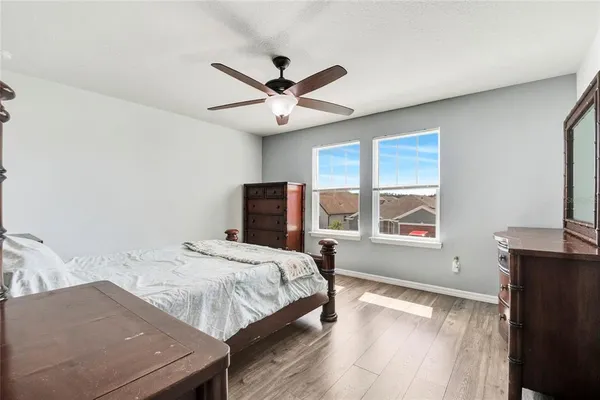 a bedroom with a bed and a table