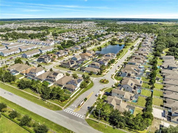 an aerial view of residential building and car parked