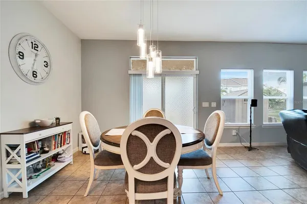 a view of a dining room with furniture and a rug