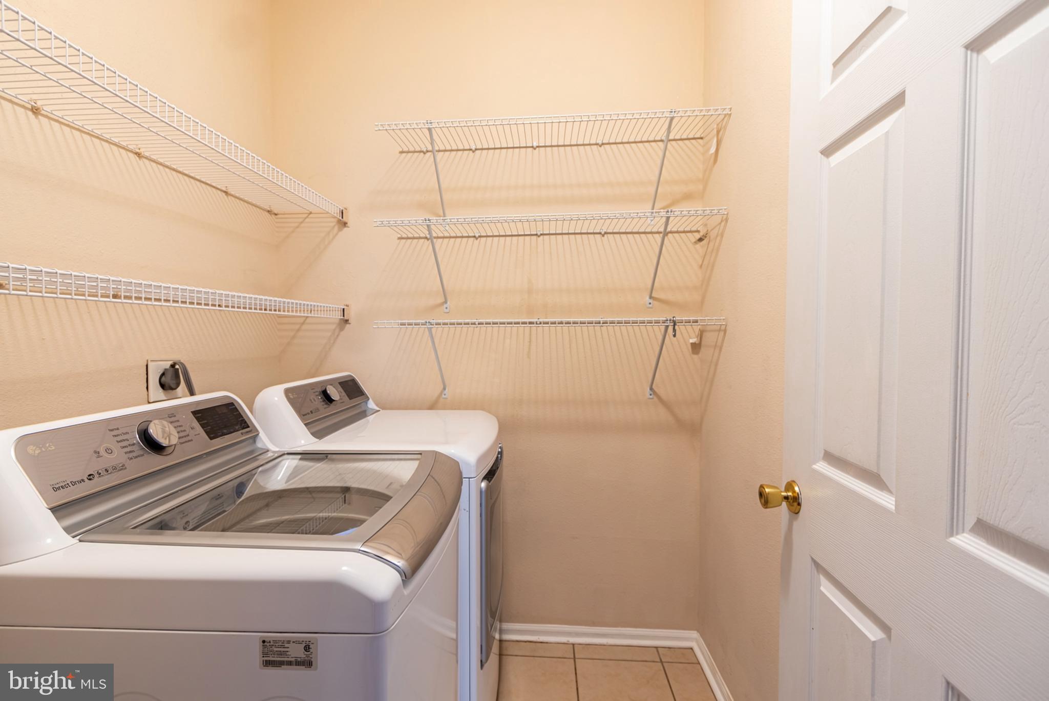1600 Spring Gate Dr., Unit 2207 McLean, VA 22102 - Photo 26 of 32 a utility room with dryer and washer