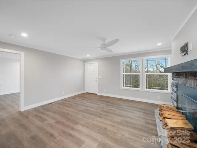 a view of an empty room with a window