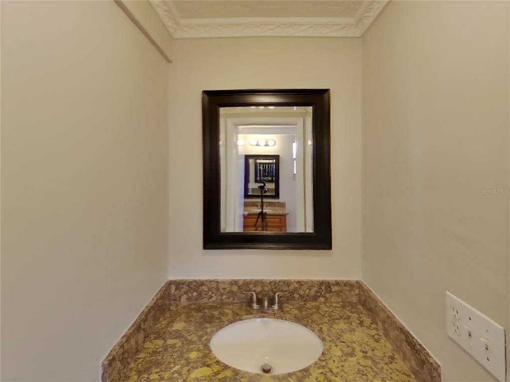 Undisclosed Address Holiday, FL 34691 - Photo 11 of 18 a bathroom with a sink and a mirror