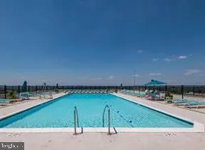 a room with gym equipment and mirror