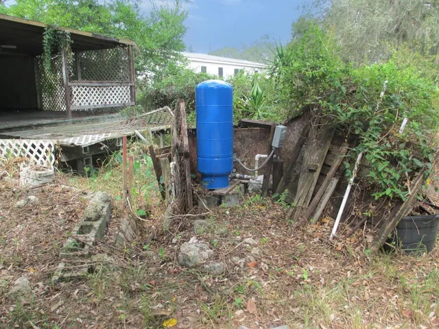 a view of a yard with furniture