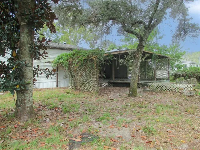 a backyard of a house with lots of green space