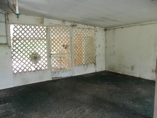 a view of an empty room and window