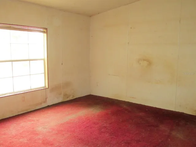 a bath tub sitting next to a window