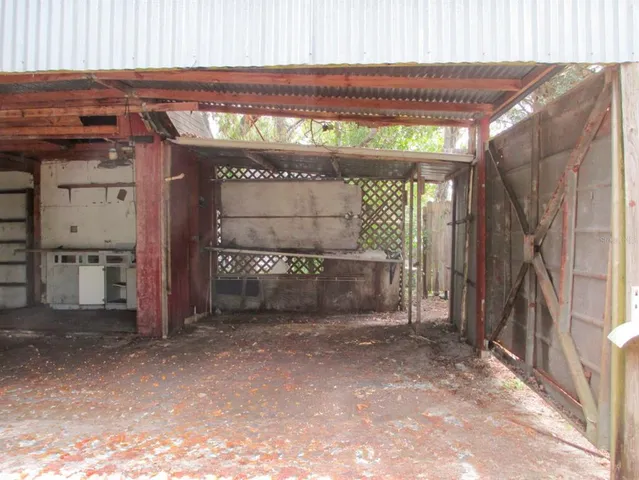 a view of a garage with an outdoor space