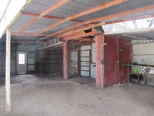 a view of empty room with wooden walls