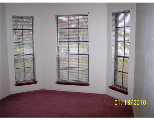 2605 Bevecrest Street Corpus Christi, TX 78415 - Photo 10 of 10 an empty room with windows