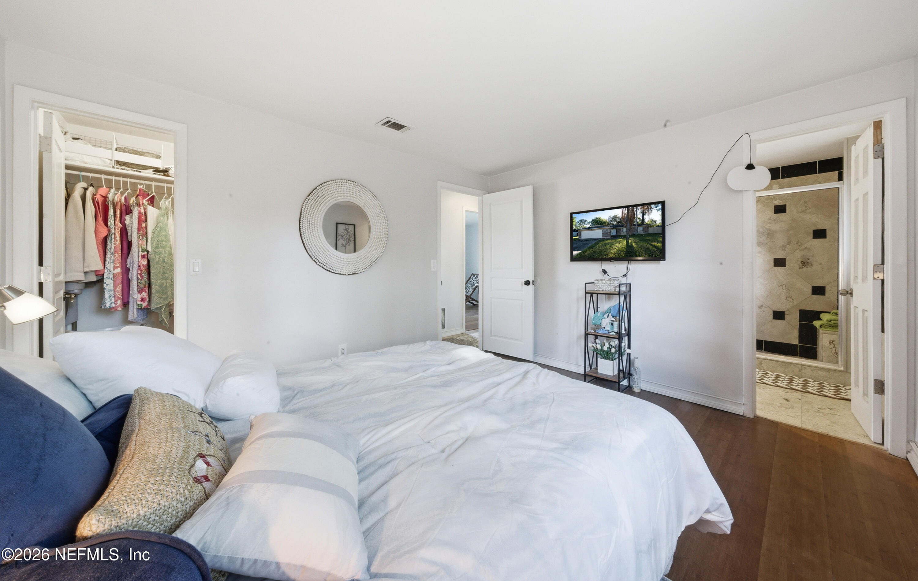 147 Knight Boxx Road Middleburg, FL 32068 - Photo 15 of 30 a bedroom with a bed and a television