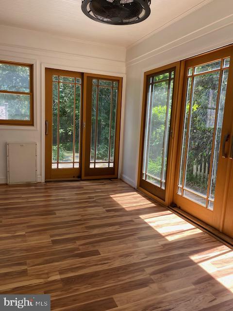 5707 Harwick Road Bethesda, MD 20816 - Photo 4 of 32 Sunlit enclosed porch w/ elegant doors & windows.