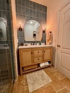 a bathroom with a sink and a mirror