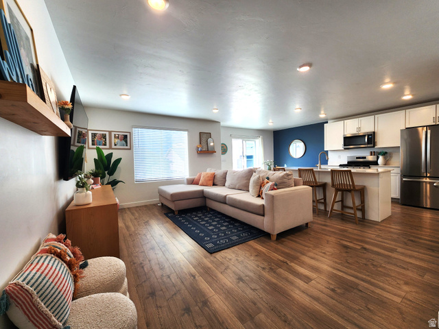 1736 East Fall Street Eagle Mountain, UT 84005 - Photo 1 of 30 Living area with dark wood finished floors and baseboards