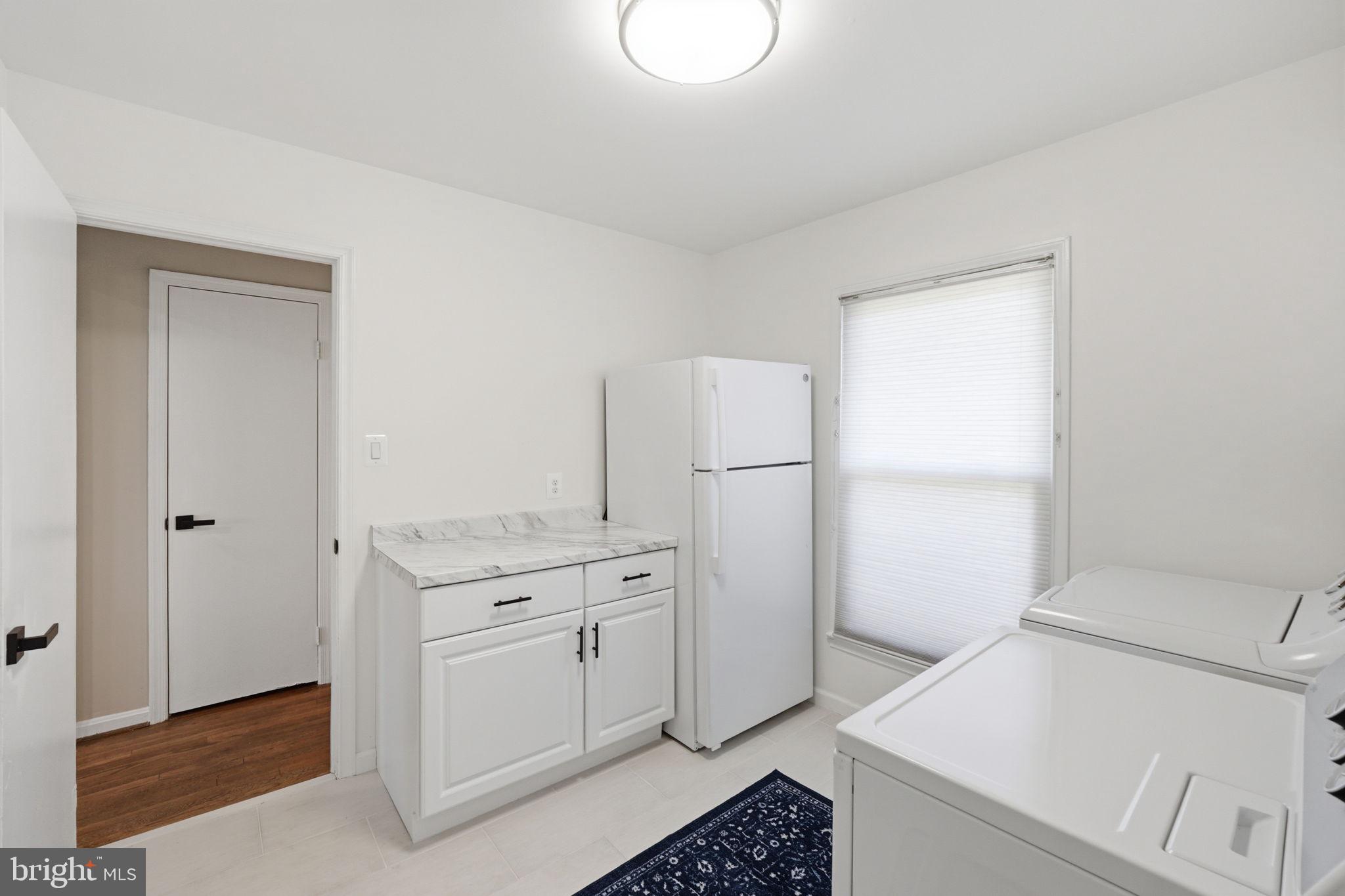 4205 Norbeck Road Rockville, MD 20853 - Photo 14 of 33 Bright and airy laundry space.