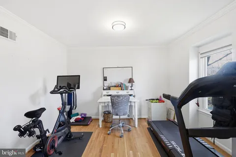 a view of room with window and hardwood floor