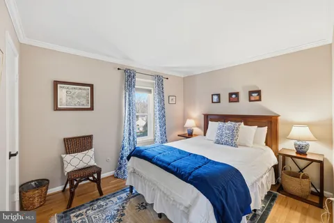 a bathroom with a double vanity sink toilet and mirror